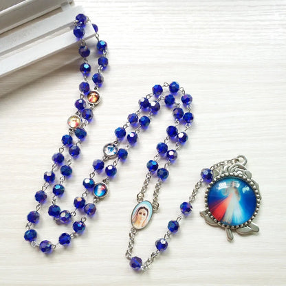 Rosario con catenella in lega e grani di cristallo blu, sfaccettati, Madonna di Fatima e Sacro Cuore di Gesù, 6 mm