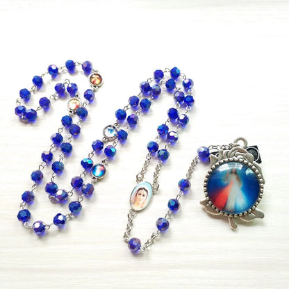 Rosario con catenella in lega e grani di cristallo blu, sfaccettati, Madonna di Fatima e Sacro Cuore di Gesù, 6 mm