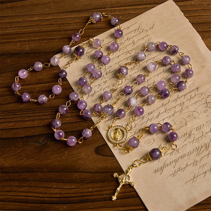 Rosario con cristallo rotondo viola dal diametro di 8 mm con immagine della Madonna di Guadalupe e crocifisso
