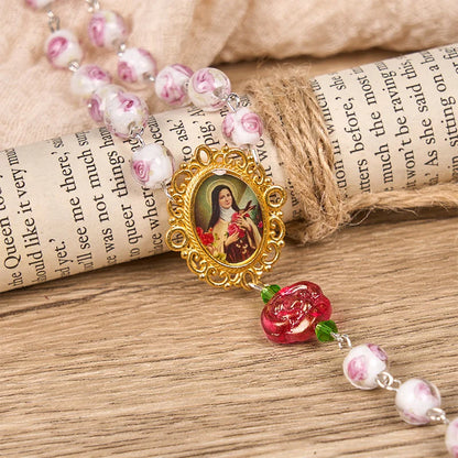 Medaglietta di Santa Teresa e crocifisso in rosa e avorio da 8 mm, rosario dall'eleganza floreale – scopri la grazia e la bellezza della fede