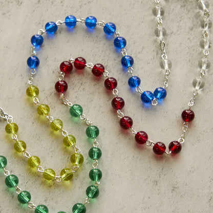 FEDE IN PREGHIERA: Rosario trasparente multicolore da 6 mm con grani arcobaleno e carta regalo