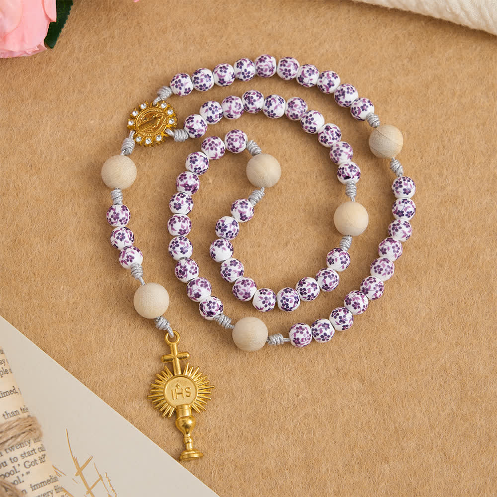 di colore viola con motivo floreale, con San Benedetto e il calice IHS