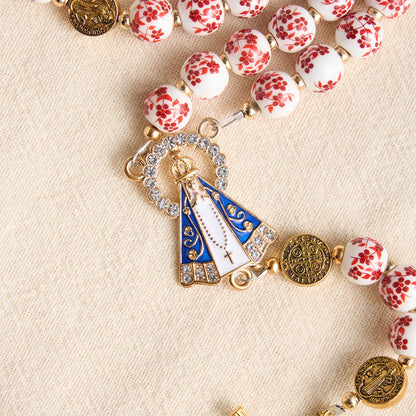 Rosario in porcellana a tre stili con stampa floreale e medaglietta della Madonna di Aparecida