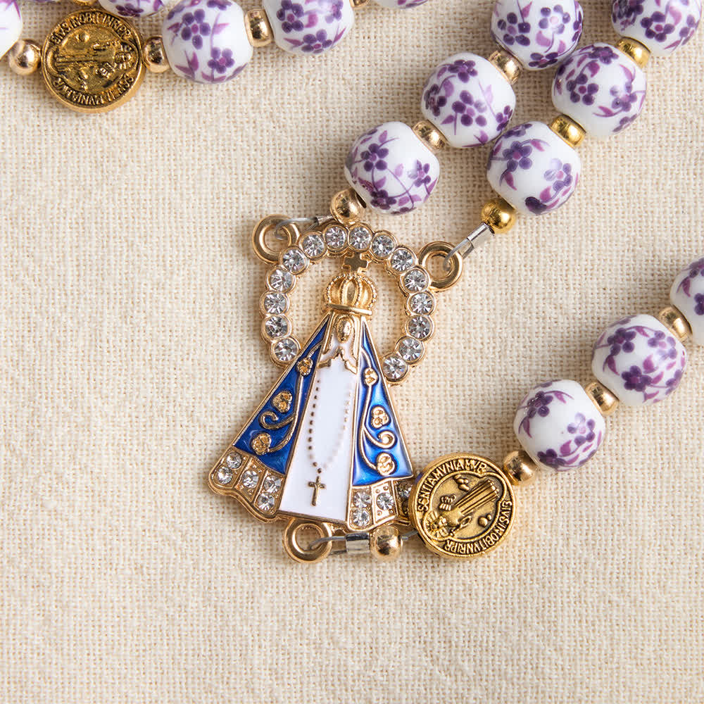 Rosario in porcellana a tre stili con stampa floreale e medaglietta della Madonna di Aparecida