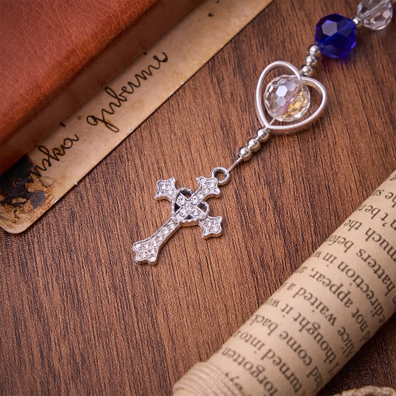 Rosario in vetro cavo a forma di cuore con perline sfaccettate blu scuro: segno di costante protezione divina