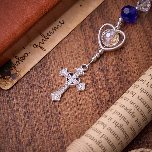 Rosario in vetro cavo a forma di cuore con perline sfaccettate blu scuro: segno di costante protezione divina