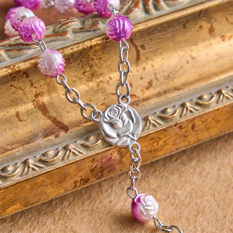 Rosario celeste con grani a forma di rosa e crocifisso: Distintivo di guida costante