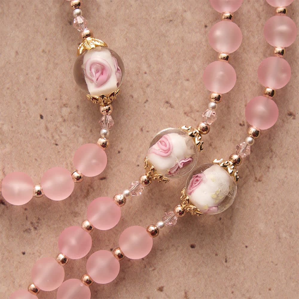 in colore rosa opaco con delicato vetro rosa e devozione a San Benedetto